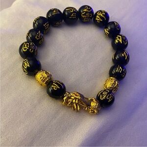 Black Bracelet with Gold Accents